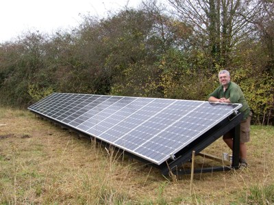 PV array on ground anchored frame